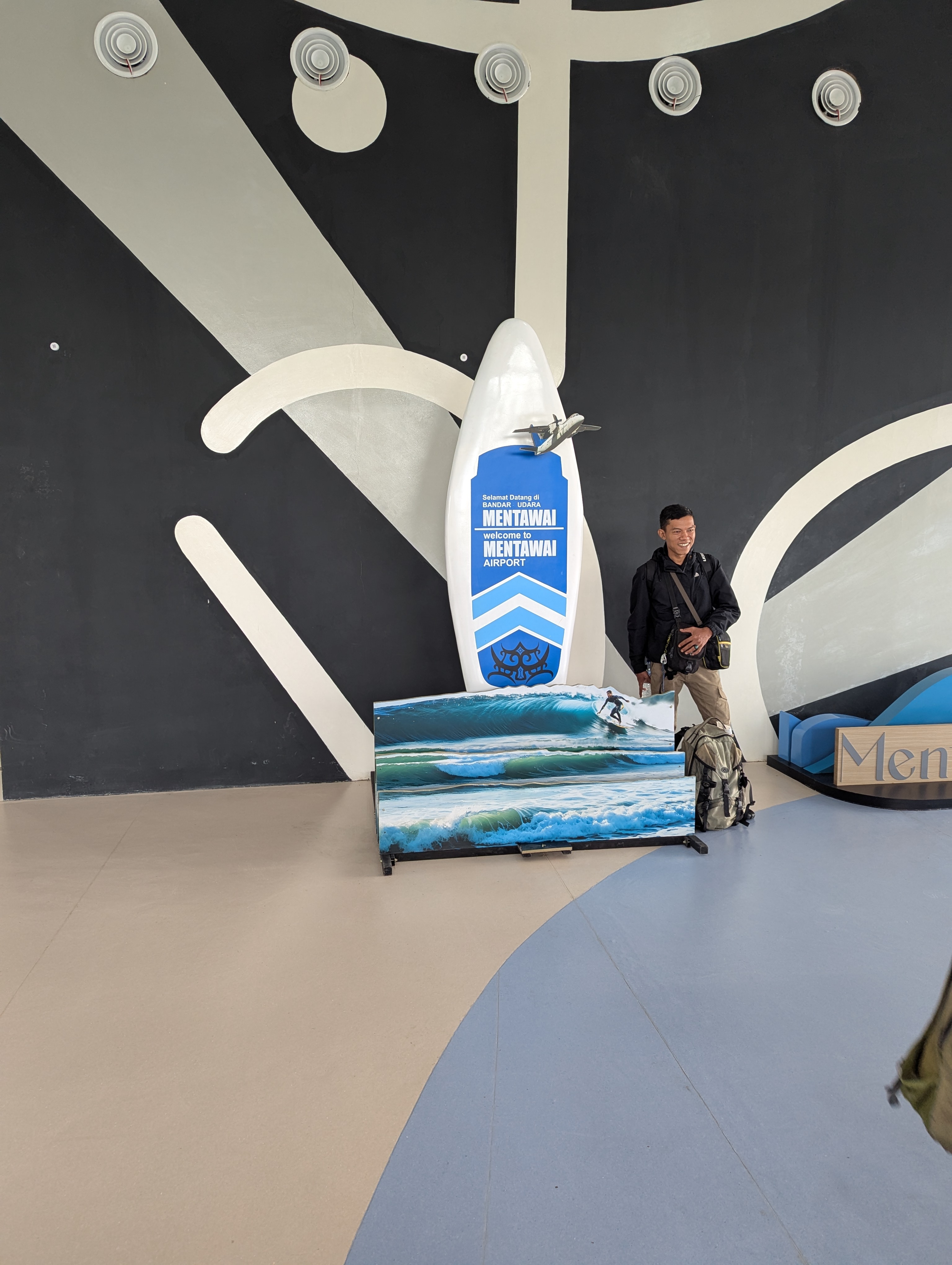 Welcome to Mentawai Airport - Surfboard welcome sign in terminal